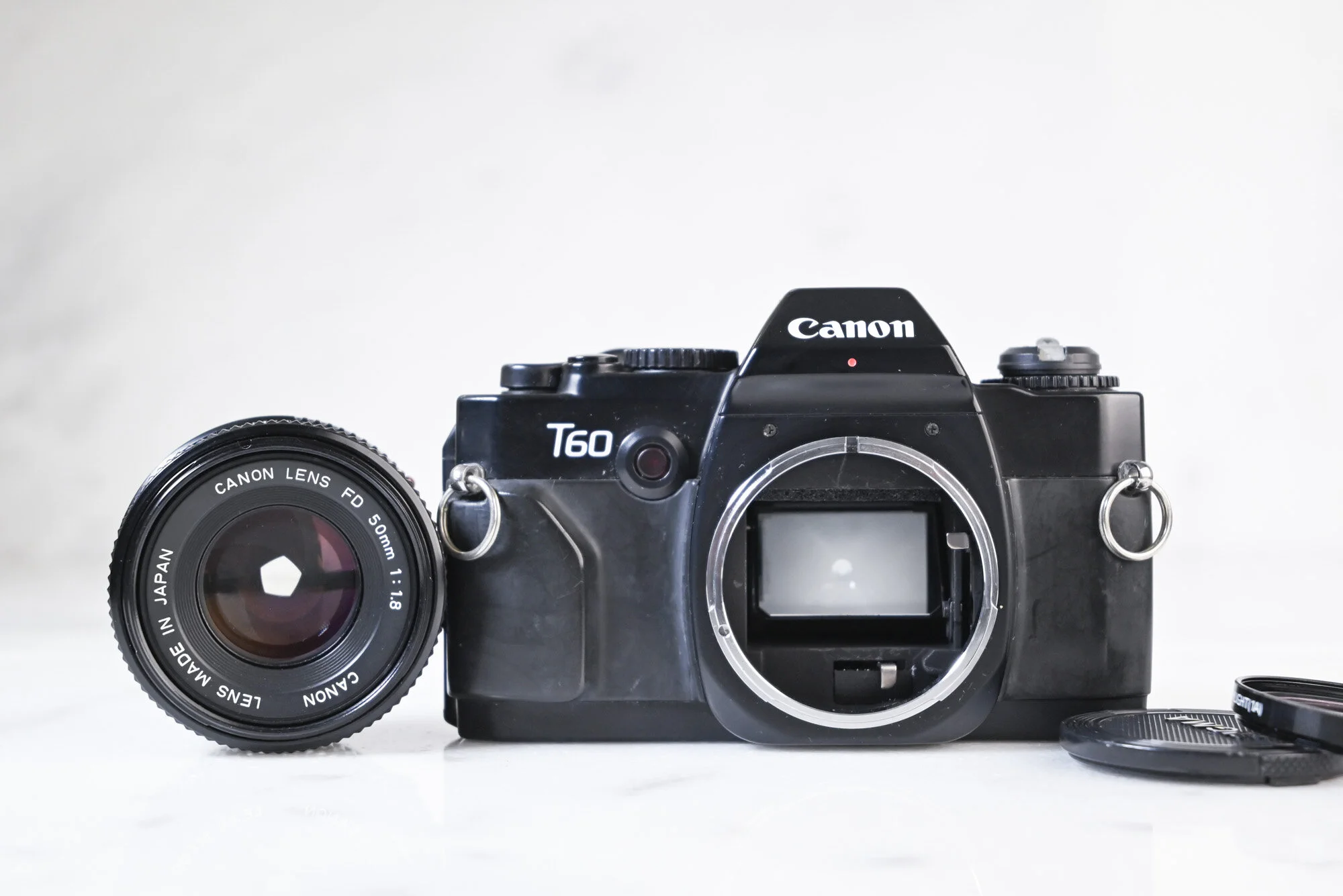 Canon T60 35mm Film SLR Camera with FD 50mm F/1.8 Fast Prime Lens
